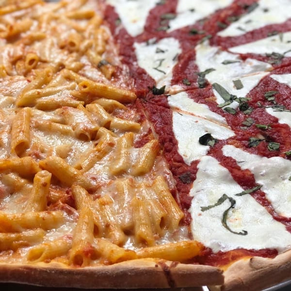 Lyndhurst Pizza's half penne pasta pizza and half Margherita pizza with fresh basil.
